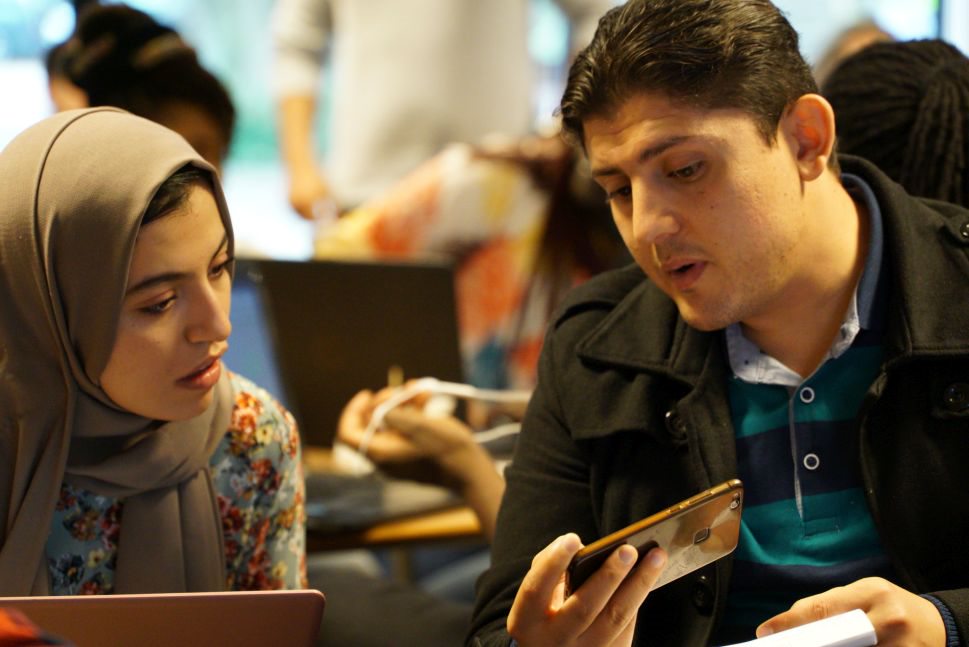 man and woman sitting next to each other