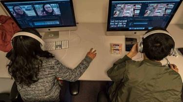 Man and woman editing video content in RNTC training