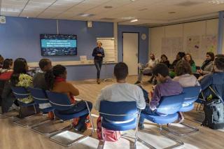 RNTC training men and women listening to trainer